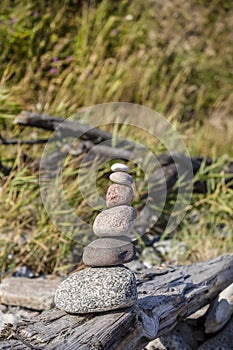 Balanced Pebble Stone Cairn On The Beach