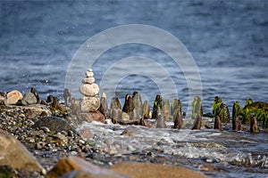 Balanced Pebble Stone Cairn On The Beach