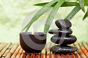 Balanced pebbles and aromatherapy candle