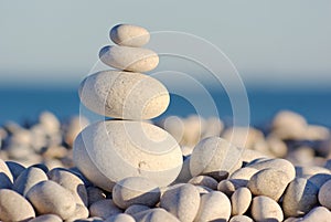 Balanced Pebbles On Seashore