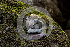 Balanced pile of stones in river
