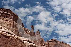 A Balanced Rock formation among Sandstone mountains in Arches National Park, Moab, Utah