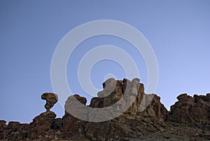 Balanced rock in the very early morning light against the blue sky