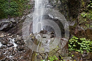 Balanced Rock Zen Stack in front of waterfall. Stones at the foot of the waterfall