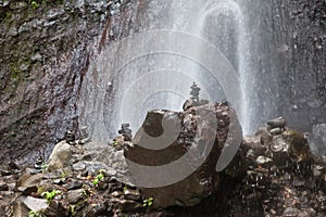 Balanced Rock Zen Stack in front of waterfall. Stones at the foot of the waterfall