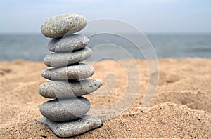 Balanced stones on beach photo