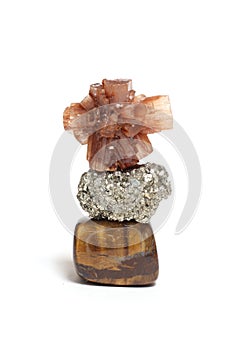 Balanced Stones Isolated on White Background. Tigers Eye with Pyrite in center and Aragonite on top