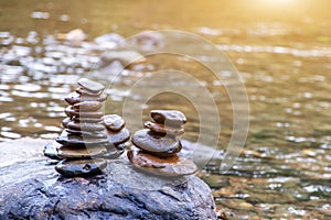 Balanced Zen rock stacks in a creek,View of a creek with stacked stones on a rock