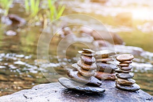 Balanced Zen rock stacks in a creek,View of a creek with stacked stones on a rock