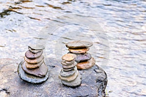 Balanced Zen rock stacks in a creek,View of a creek with stacked stones on a rock