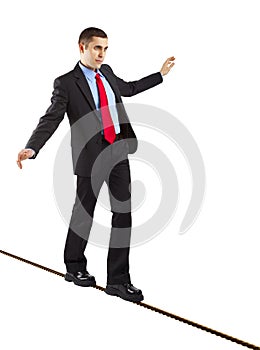 Balancing businessman photo