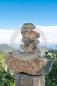 Zen pile of rocks made on the top of the mountain. California