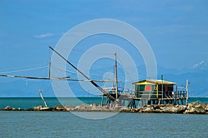 Balancing fishing hut at the river mouth