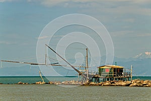 Balancing fishing hut at the river mouth
