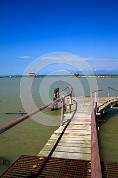 Balancing fishing hut at the river mouth