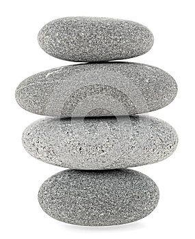 Balancing stone tower isolated on white background. Pebble stones