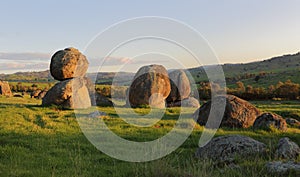 Balancing stones across the landscape