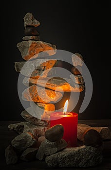 Balancing stones with a candle
