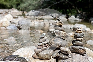 Balancing stones on the mountain river