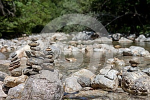 Balancing stones on the mountain river