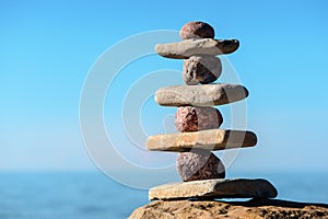 Balancing stones on the seashore