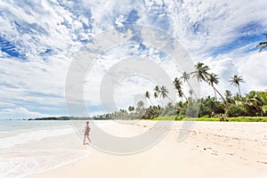 Balapitiya, Sri Lanka - A young woman enjoying nature at the beach of Balapitiya