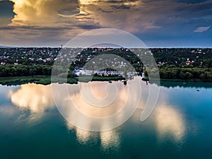 Balatonfuzfo, Hungary - Aerial view of Balatonfuzfo yacht marina at sunset with beautiful clouds and reflection