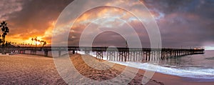 Balboa Pier California sunrise and storm clouds