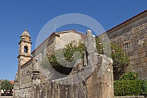 Balboa sculpture custodian and San Benito church, Cambados, Pontevedra province, Galicia, Spain