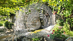 Historical water wheel at Balcik Botanical Garden photo