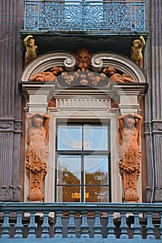 Balcon with statues of house of the merchant Utin in Saint Petersburg, Russia photo