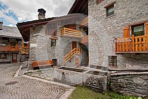 Balconies in the alpine village street stone houses