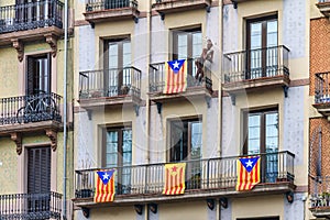 Balconies in Barcelona Spain Gothic Quarter decorated with Catalan independence flag Senyera estelada meaning 