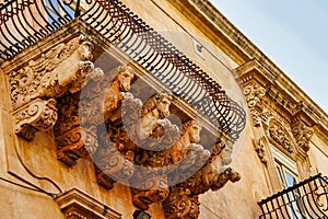 Balconies in Baroque style of Via Nicolaci in Noto, Sicily, Italy