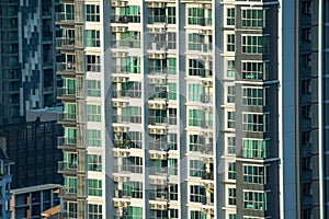 Balconies and windows in a tall residential building.