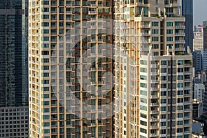 Balconies and windows in a tall residential building.