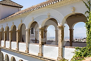 Balcony with arches in a patio de la Acequia La Alhambra, Granada, Spain