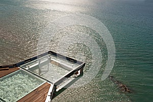 Balcony as a viewpoint over the sea, in sunset