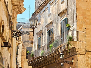 Balcony of a baroque palace in Lecce, Puglia. photo