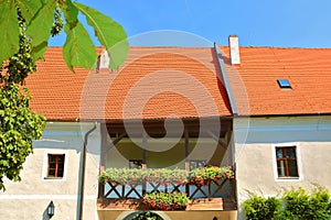 Balcony with bright flowers in medieval Cerveny Kamen Red Stone Castle near Casta village, Slovakia