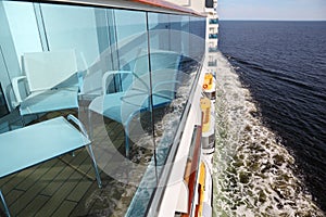 Balcony with chairs and table on cruise liner