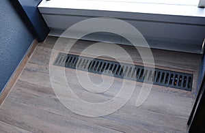 Balcony drainage or gutter. A close-up of a balcony floor drainage system with a self regulating heating, deicing cable installed