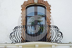 Balcony facade of old Italian building with Windows
