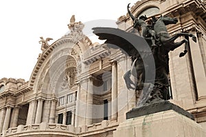 The balcony on the facade of the Palacio de Bellas artes the Palace of fine arts and one of the Pegasus Statues next to it, Mexico