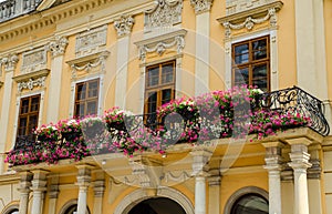 Balcony with flowers on a historic building in Kosice photo