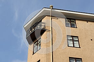 Balcony with a forged grille and downspout