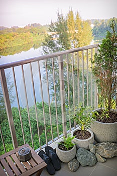 A balcony with greeneries in HDB BTO apartment at Sumang 325B, Singapore.