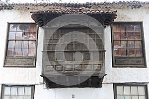 Balcony with lattice windows of a typical Canarian house in Plaza ConstituciÃÂ³n, Icod de los Vinos, Tenerife. Spain