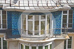 Balcony with metal fence on the top floor of the building apartment.