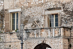 Balcony of an ol stone house in downtown Trani, Italy